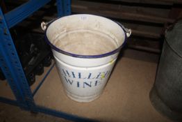 An enamelled bucket with metal swing handle for 'C
