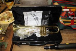 A cased Student Series trumpet