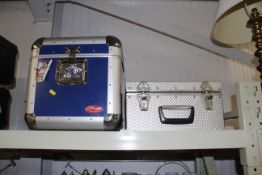 A Stag metal ware travel case and another similar