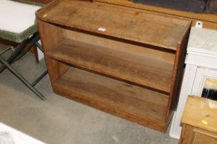 A hardwood open fronted bookshelf