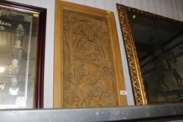 A carved hardwood relief plaque depicting elephant