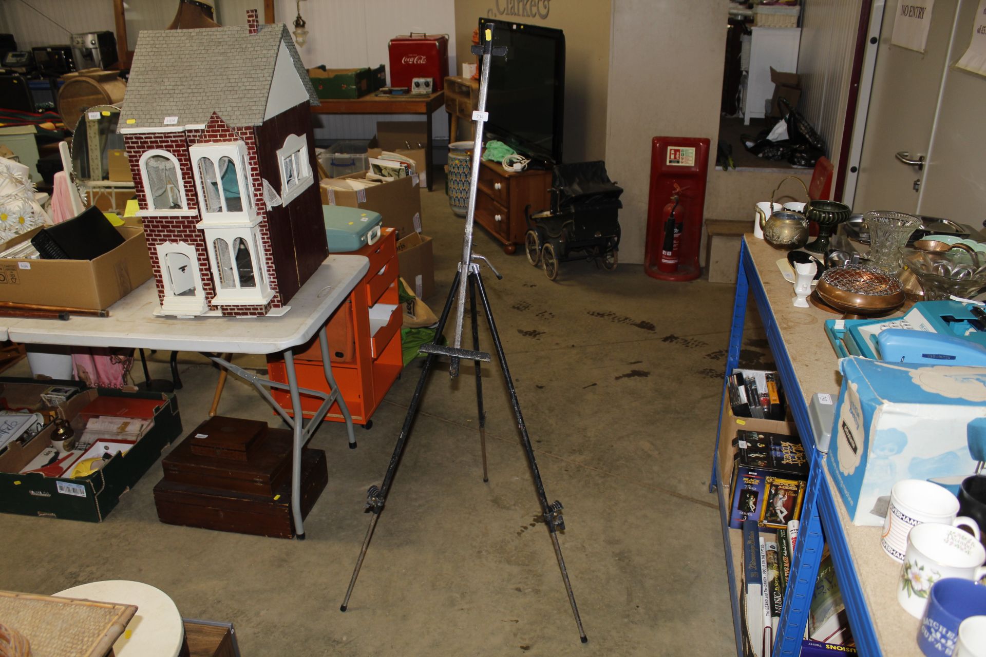 A metal ware travelling artists easel