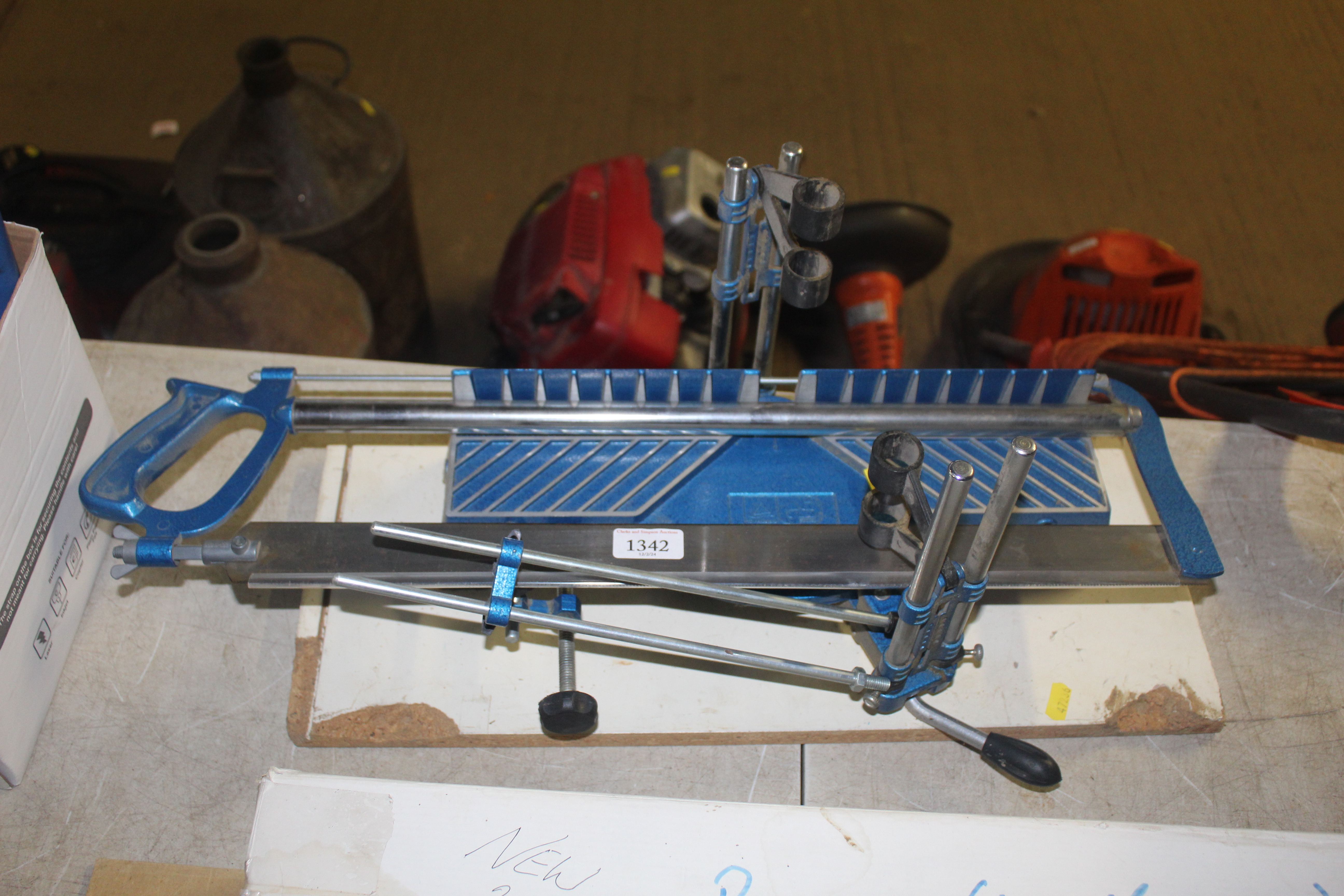 A mitre saw mounted to wooden board