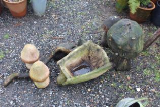 A pair of terracotta mushrooms; two wooden mushroo