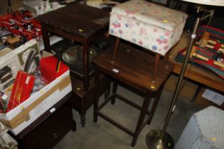 An oak occasional table and an upholstered work bo