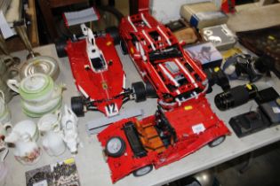 An F1 model car, another and a model of a vintage