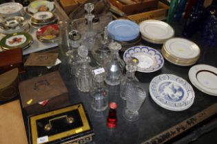 A collection of glassware including decanters, wat