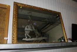 A decorative gilt frame wall mirror with etched de