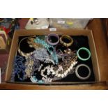 A box of various costume jewellery and bangles