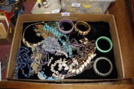 A box of various costume jewellery and bangles