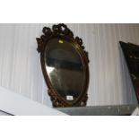 A heart shaped gilt framed wall mirror