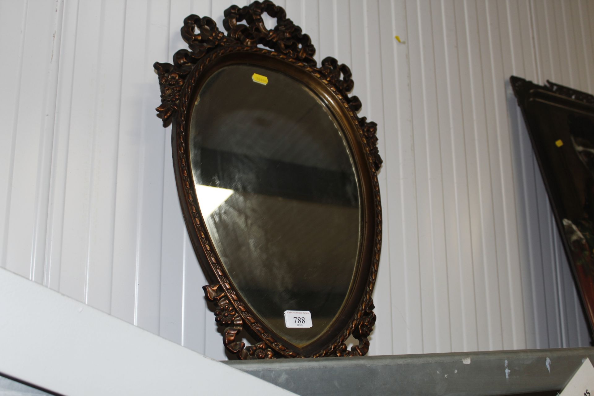 A heart shaped gilt framed wall mirror