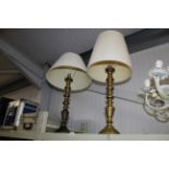 A pair of brass table lamps with shades