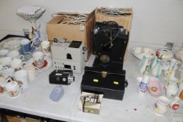 A collection of cine projectors, camera and access