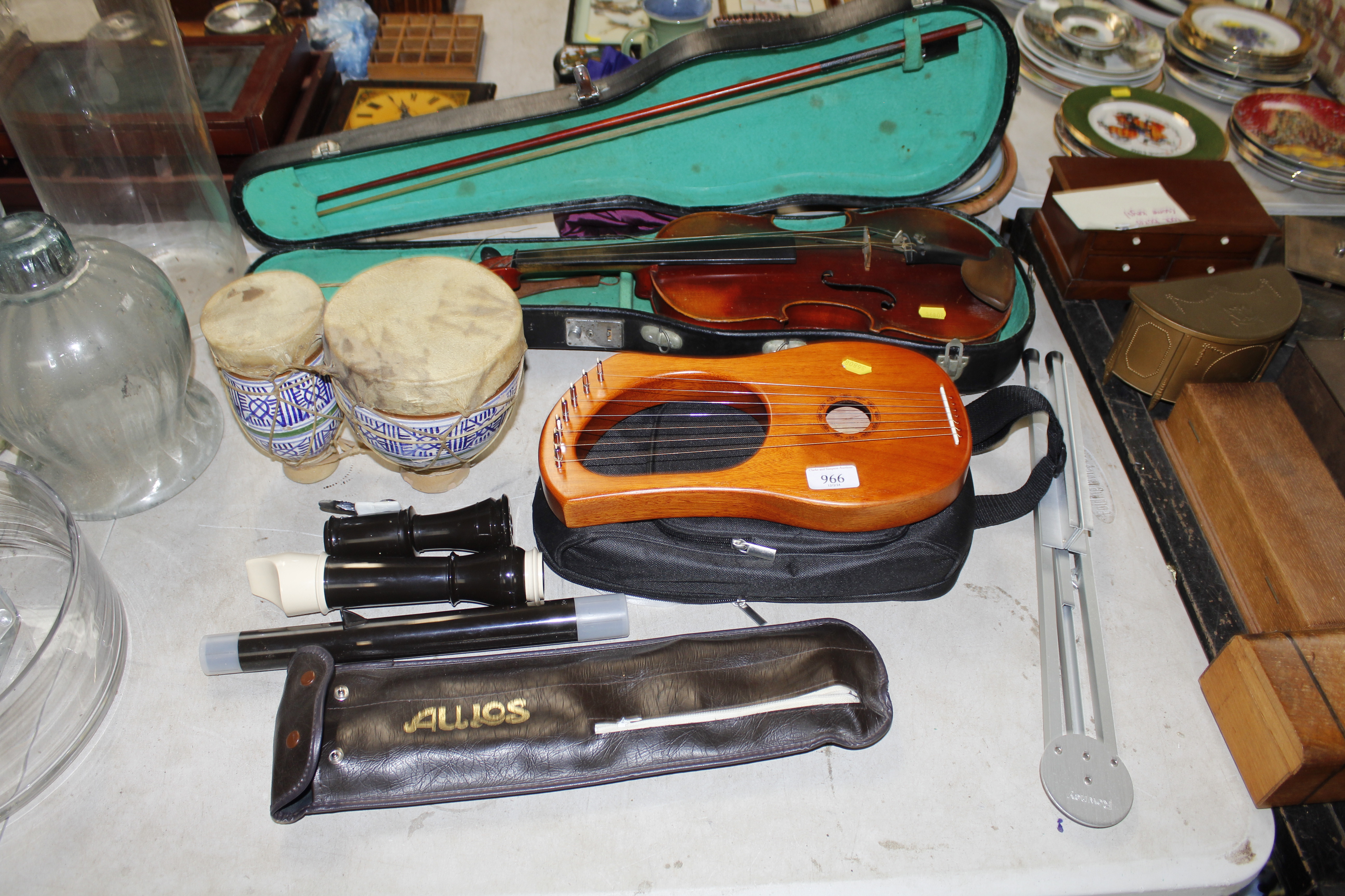 A cased violin and bow, various other musical inst