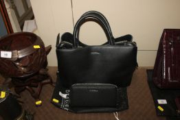 A Fiorelli ladies black leather handbag and matchi