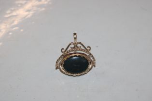 A 9ct gold three stone swivel fob