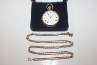 A gold plated pocket watch with yellow metal chain