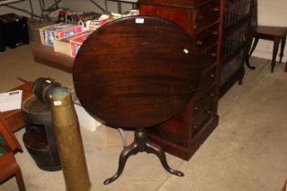 A 19th Century snap top table raised on tripod bas