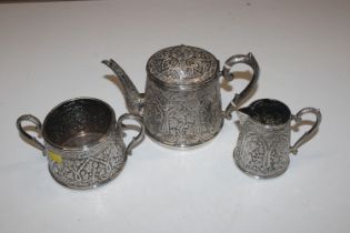 An Eastern silver three piece tea set with engraved monogram to base, approx. total weight 43oz