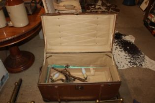 A wooden and metal bound travelling trunk and cont