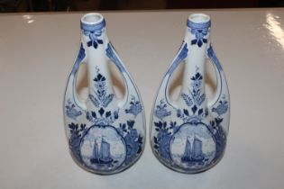A pair of Delft blue and white twin handled vases