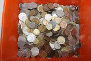 A box of various foreign coinage