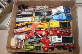 A box of various Matchbox die-cast vehicles