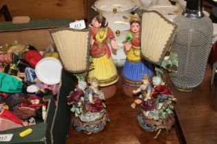A pair of figural decorated table lamps and a pair