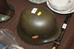 A German WWII type double decal helmet