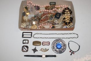 A box of various costume jewellery to include broo