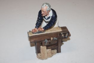 A Royal Doulton figure "The Carpenter" HN2678