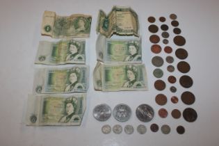 A box of British coins and bank notes including £1