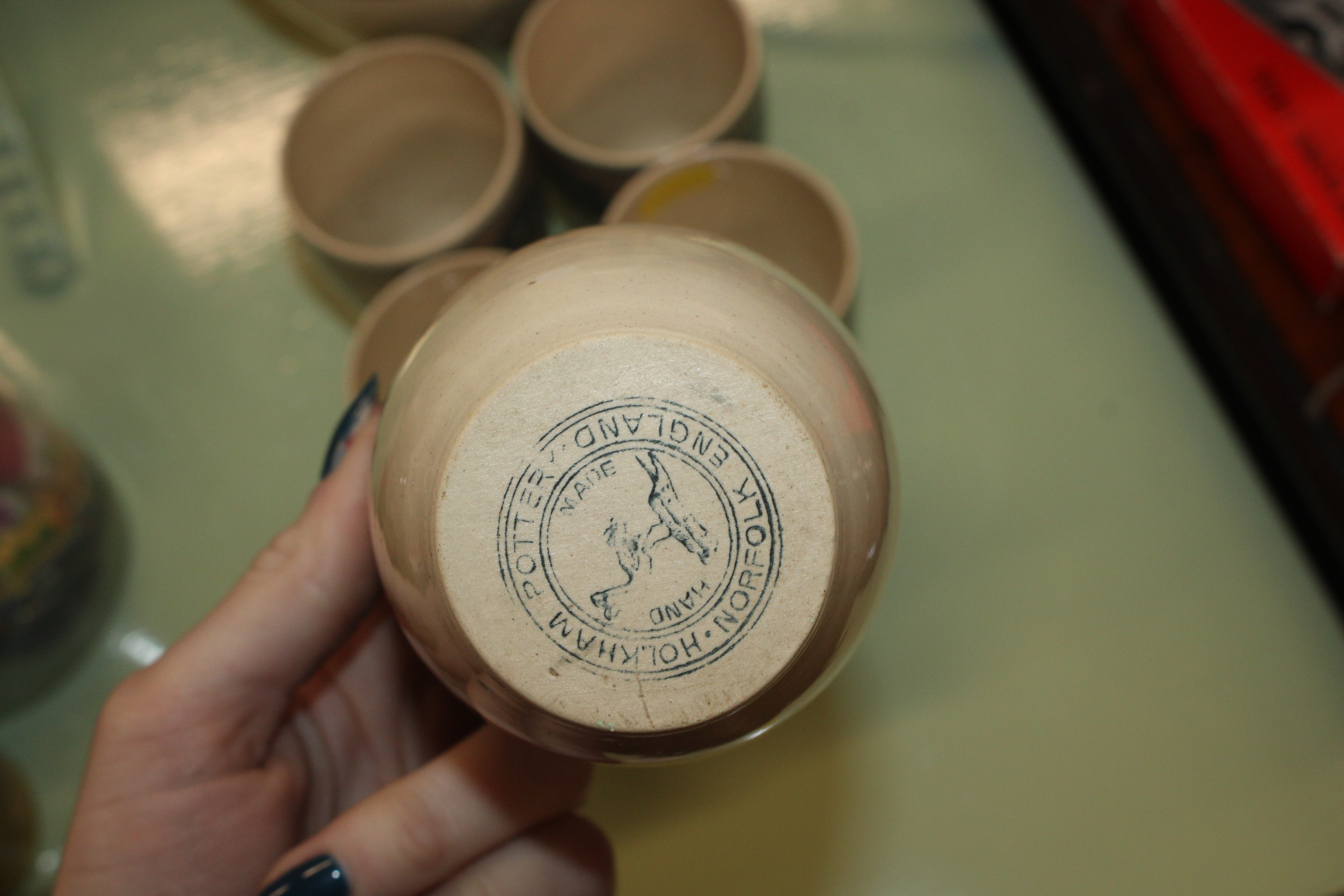 A Holkham pottery jug and five pottery cups - Image 2 of 2