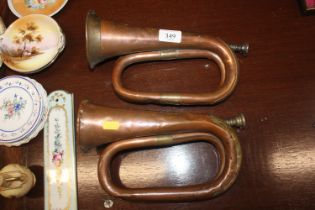 Two copper and brass bugles