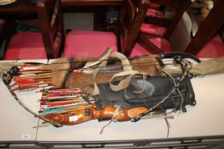 An American Compound bow and a large quantity of v