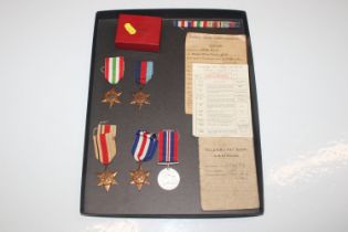 A collection of WWII medals to include The Italy Star, The Africa Star, The France and Germany Star,