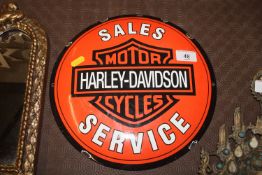 A reproduction enamel Harley Davidson sign