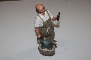 A Royal Doulton figure "The Blacksmith" HN2782