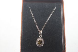 A 925 silver and amber pendant on chain