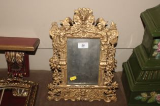 A gilt metal easel photo frame