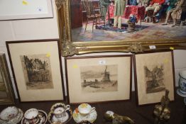 Three framed and glazed pencil signed etchings depicting Dutch scenes
