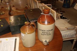 A stoneware 1gallon Aspells Cider flagon and one o