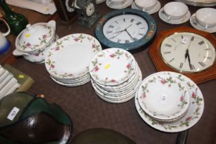 A quantity of rose decorated dinnerware