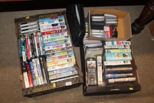 Two boxes of various DVD's, VHS and cassette tapes