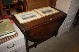 An oak gate leg dining table