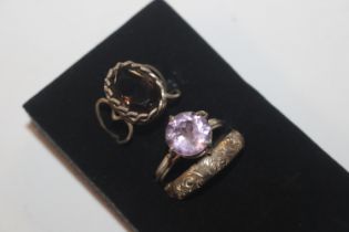 Three antique white metal dress rings, including a