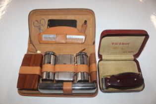 A men's cased grooming kit and a Viceroy hair clip