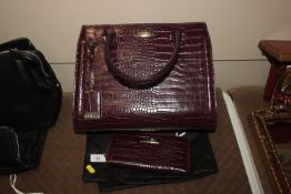 A Carvela ladies hand bag and matching purse