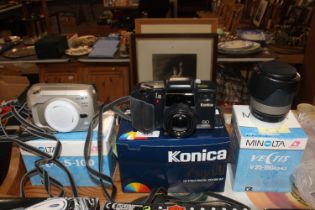 A Konica Z-UP80 camera and a Minolta camera body a